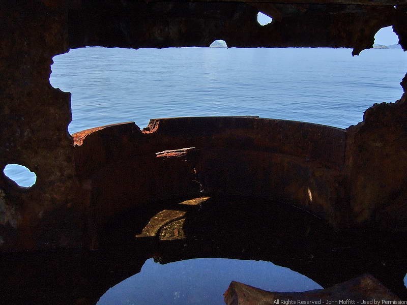 Battery Roberts - View out the lower 6 inch gun port. Water is reflecting on the floor.