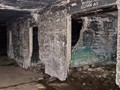 Note the black burned walls in most interior photos.